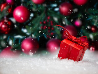 gift box in the snow under the Christmas tree