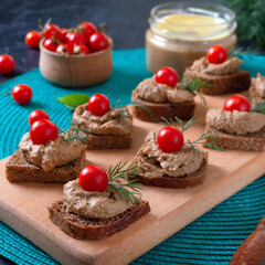 Canapes with rye bread, liver pate, cherry tomatoes. Breakfast snack.