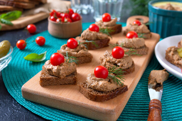 Canapes with rye bread, liver pate, cherry tomatoes. Breakfast snack.