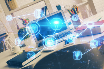Computer on desktop with social network hologram. Multi exposure. Concept of international people connections.