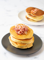 A fresh made pancake with crispy bacon and syrup, traditionale Dutch recipe