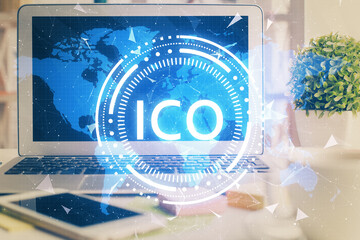 Multi exposure of blockchain and crypto economy theme hologram and table with computer background....