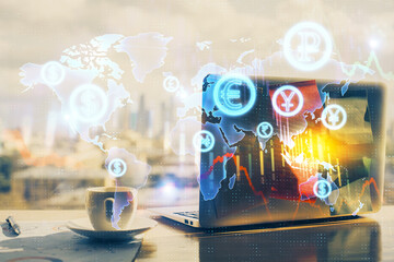 Double exposure of forex graph and work space with computer. Concept of international online trading.