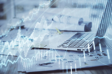 Forex Chart hologram on table with computer background. Double exposure. Concept of financial markets.