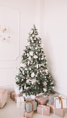 Christmas home interior. Christmas tree toys and gifts. New Year home decorations