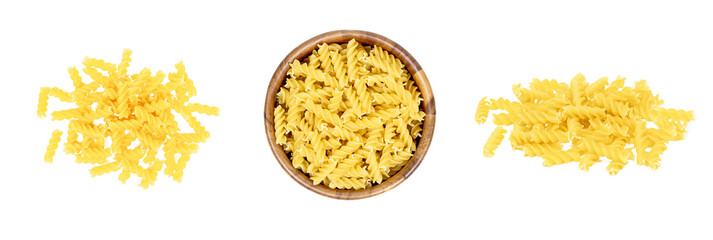 Top view of yellow uncooked fusilli pasta set isolated on white background.