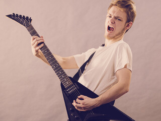 Man playing on electric guitar