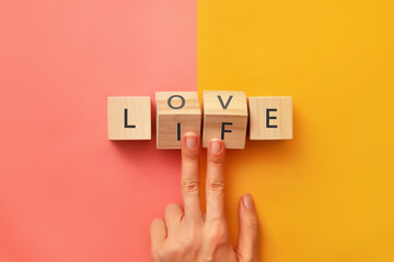 Wooden cubes with the inscription: love and life. Life with love