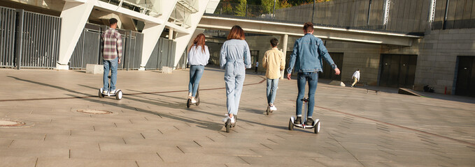 It will take you to new friends. Joyful girls and boys riding kick scooters and segways