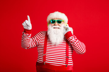 Fototapeta na wymiar Portrait of his he handsome bearded fat overweight cheerful Santa listening single hit sound having fun rest relax chill amusement free time isolated bright vivid shine vibrant red color background