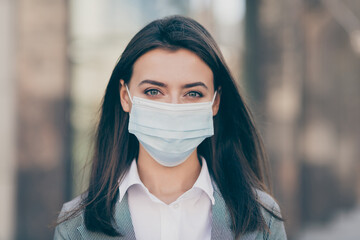 Photo of attractive young business person work in pandemic wear medical mask protection in outdoors