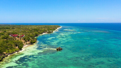 Beautiful sandy beach and turquoise water in Anda resort, Philippines.