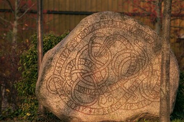 rune stone with midgard serpent in Trelleborg Sweden, viking runes	