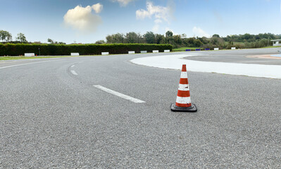 Test drive asphalt track red traffic cone sign for driving school