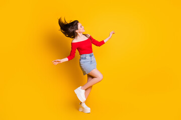 Fototapeta na wymiar Full length body size view of her she nice-looking attractive pretty cheerful thin girl dancing having fun free time isolated bright vivid shine vibrant yellow color background