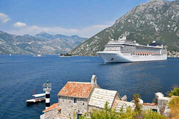 Tourist liner floats in the Bay of Kotor. View from the church of Gospa od Andela - Verige