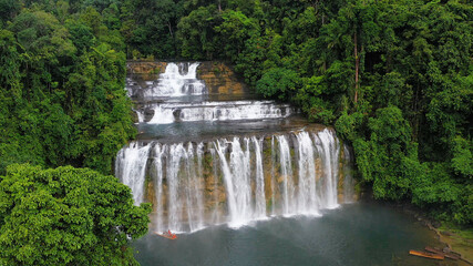 Waterfall in the green forest. Tinuy-an Falls in the jungle, island of Mindanao, Philippines.