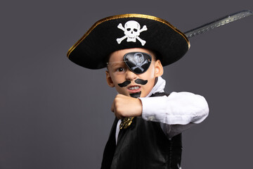 The classic pirate captain character, brandishing a saber. Halloween holiday concept on gray background