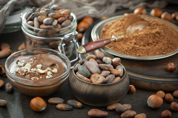 Cocoa beans on old background
