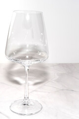 wine glass on marble on white background