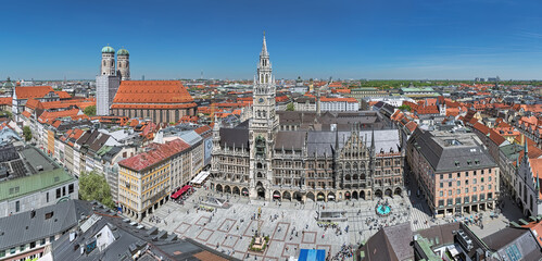 Munich, Germany. Panorama of Marienplatz square with New Town Hall and Frauenkirche (Cathedral of Our Lady). View from the lookout deck on the tower of St. Peter's Church.