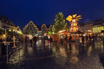 Weimar, Germany. Panoramic view of Christmas market at Market Square in dusk. Two illuminated...