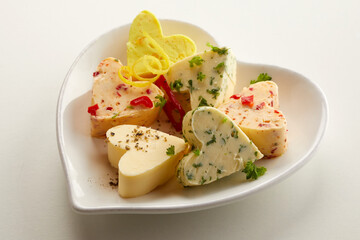 Savory heart shaped butter pats in assorted flavor