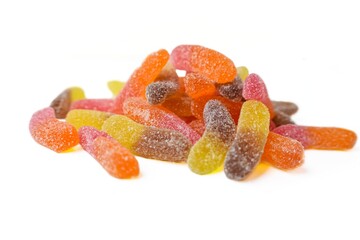 Marmalade worms on a white background. Sweets. Unhealthy food.