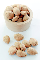 Raw almonds on white background.