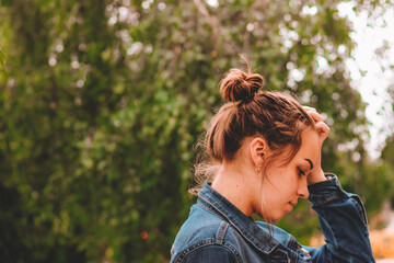conceived girl with a ball on a background of nature