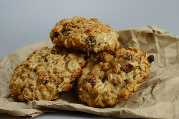Homemade oatmeal cookies with raisins on craft paper