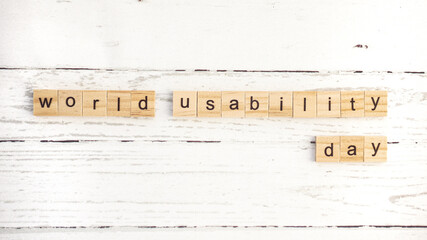 World Usability Day.words from wooden cubes with letters photo