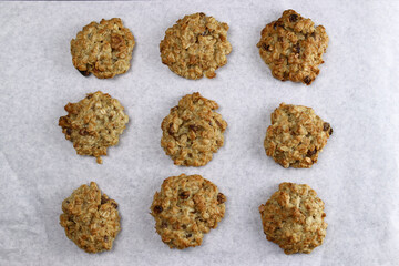 Homemade oatmeal cookies with raisins on a gray background