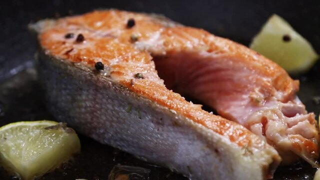 grilled rainbow trout or salmon steak with spices, garlic and lemon. Dolly video