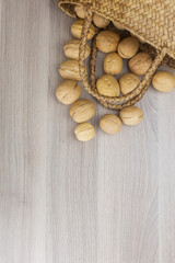 Natural walnuts pile pattern, background blurred edges frame, food in shell nuts walnuts.