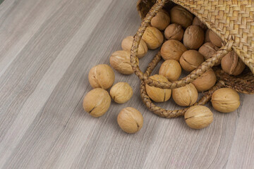 Walnut and walnut kernel. Top view of walnuts in nutshells in full screen.