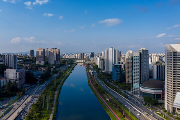 Fototapeta na wymiar View of Marginal Pinheiros with the Pinheiros river and modern buildings in Sao Paulo, Brazil