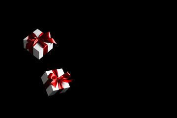 Sale background black. White gifts with red bow falling on dark background for Black Friday banner. Flying backdrop with space for text. - Powered by Adobe