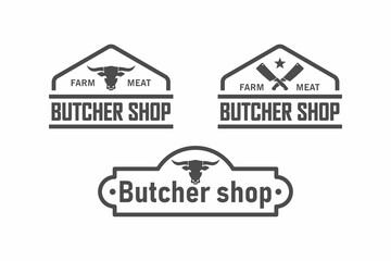 Fototapeta premium Set of black and white illustrations bull head, crossed knives, text on a white background.Vector illustration for logos, emblems, signage. Butcher shop, farm, butchery logo.