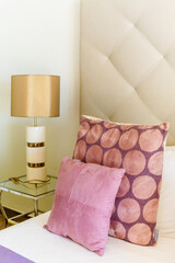 Side table with white lamp in the bedroom