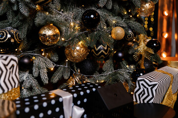 Beautiful festive Christmas tree is in the room decorated with Christmas toys balls