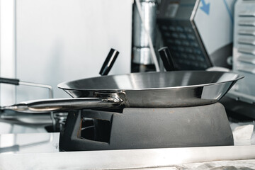 New clean wok pan in proffesional kitchen
