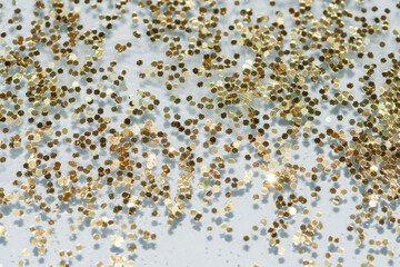 gold shiny glitter on a blue background