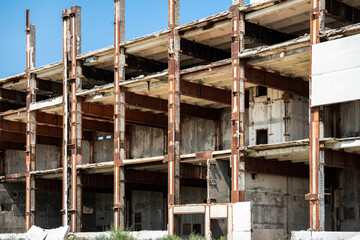 Unfinished and abandoned building in the section. You can see the frame of the building and its internal structure. The building is slowly being destroyed.