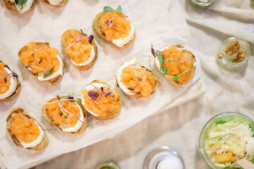 Canapes and light meals, tapas on the table in the restaurant.