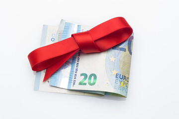 Money decorated with pretty colored bows