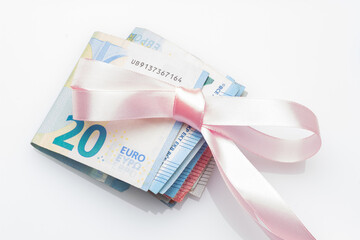 Money decorated with pretty colored bows