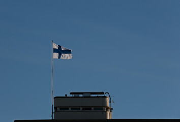 Finnish blue and white flag waving in the wind