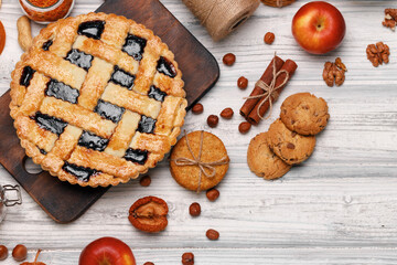 Berry tart pie on white wooden table