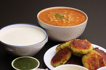 Ragda pattice -Aloo tikki or Potato Cutlet or Patties is a popular Indian street food made with boiled potatoes, spices and herbs served with tamrind chutney and peas curry.